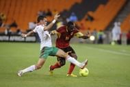 Angola's forward Geraldo (R) clashes with Morocco's midfielder Nordin Amrabat on January 19, 2013